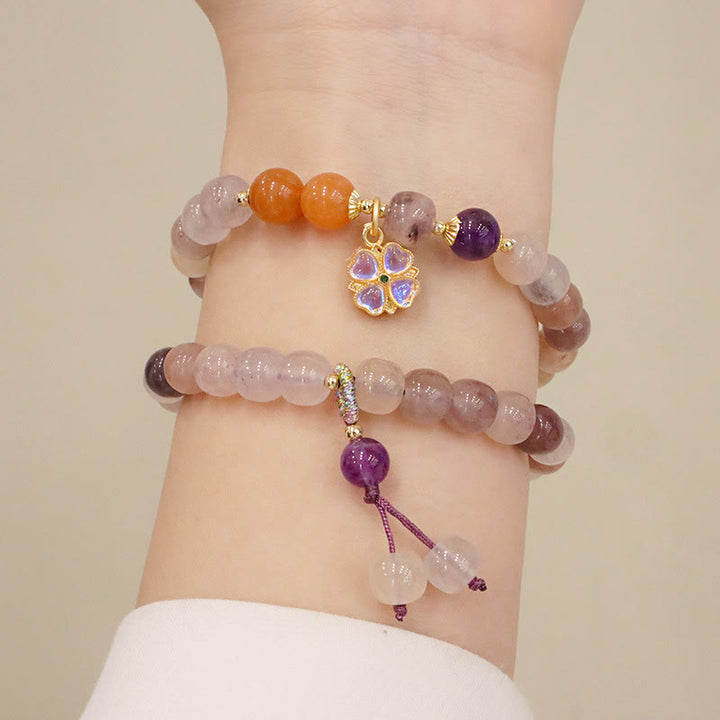 Bracelet de richesse en perles de jade violet doré en Buddha Stones