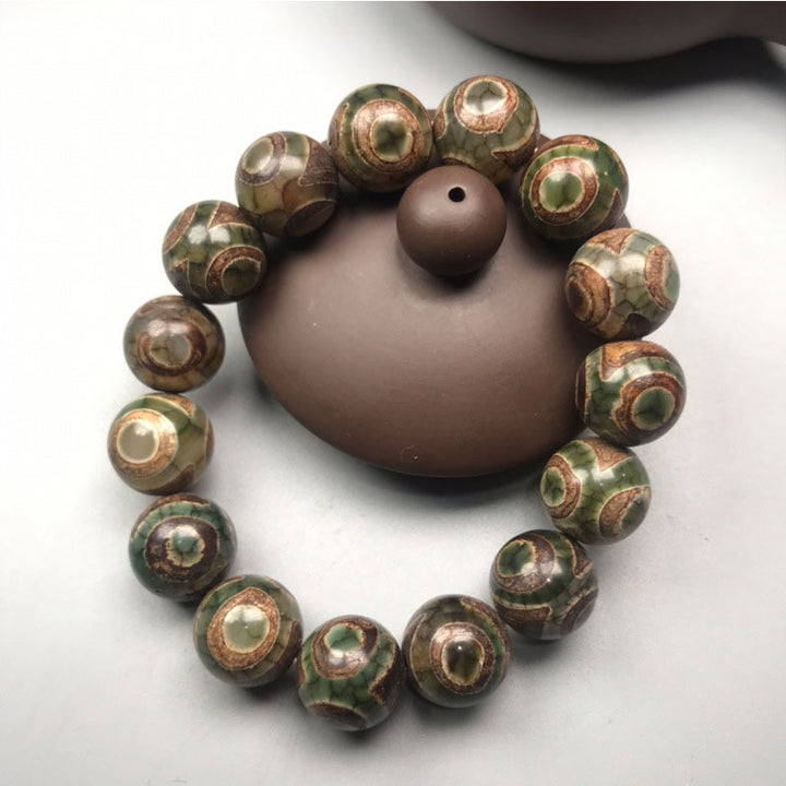 Bracelet porte-bonheur en perles dzi à trois yeux en sardonyx avec Buddha Stones