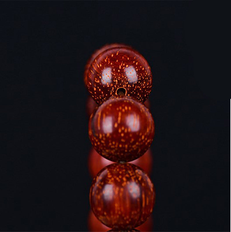 Bracelet d'équilibre tibétain en petites feuilles de santal rouge avec Buddha Stones