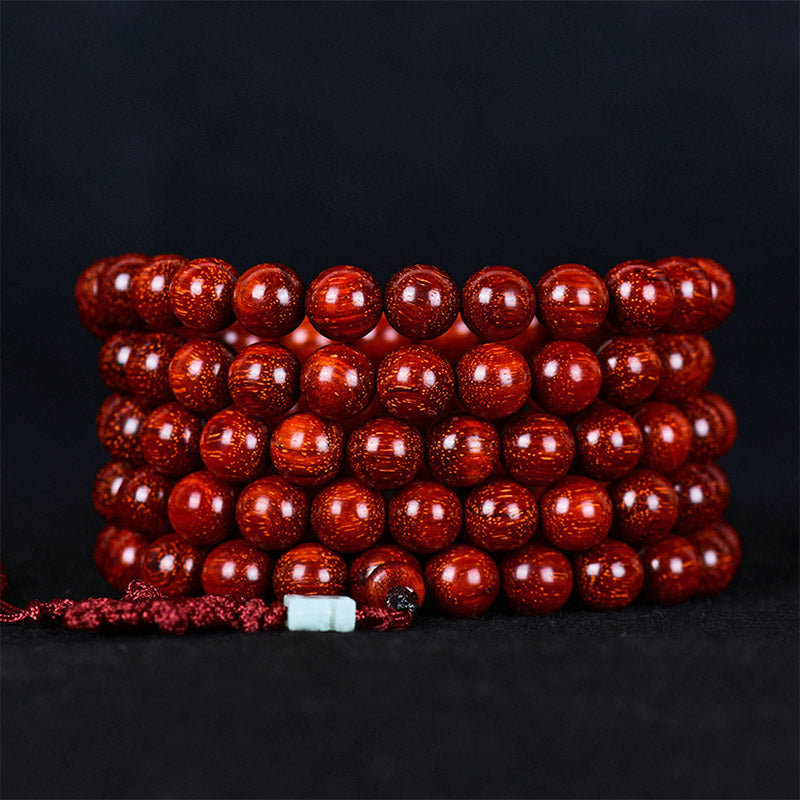 Bracelet d'équilibre tibétain en petites feuilles de santal rouge avec Buddha Stones
