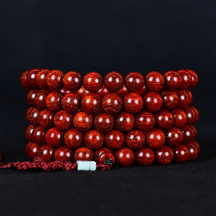 Bracelet d'équilibre tibétain en petites feuilles de santal rouge avec Buddha Stones