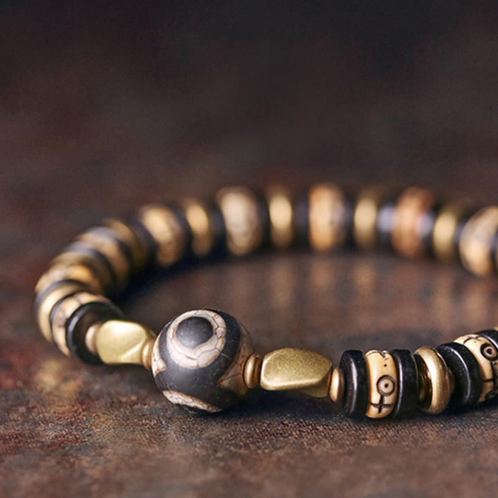Bracelet de force en bois d'ébène et perles d'os tibétaines en Buddha Stones