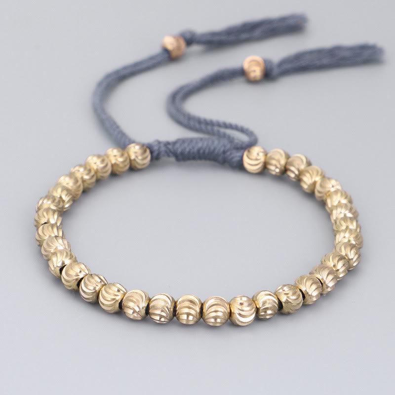 Bracelet porte-bonheur en perles de cuivre tibétaines faites à la main avec Buddha Stones
