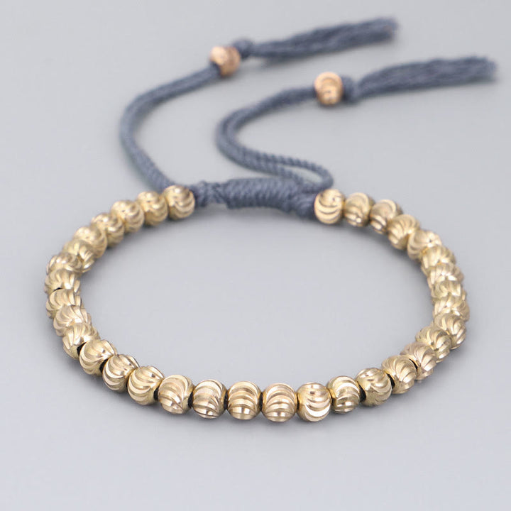 Bracelet porte-bonheur en perles de cuivre tibétaines faites à la main avec Buddha Stones