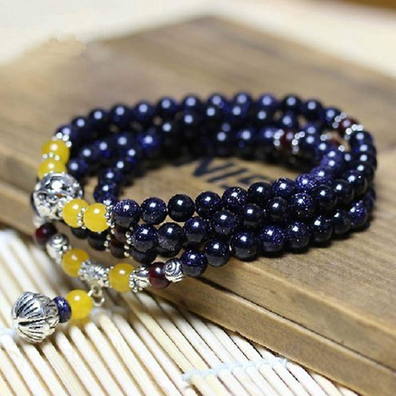 Bracelet Mala en grès bleu avec breloques de richesse et Buddha Stones