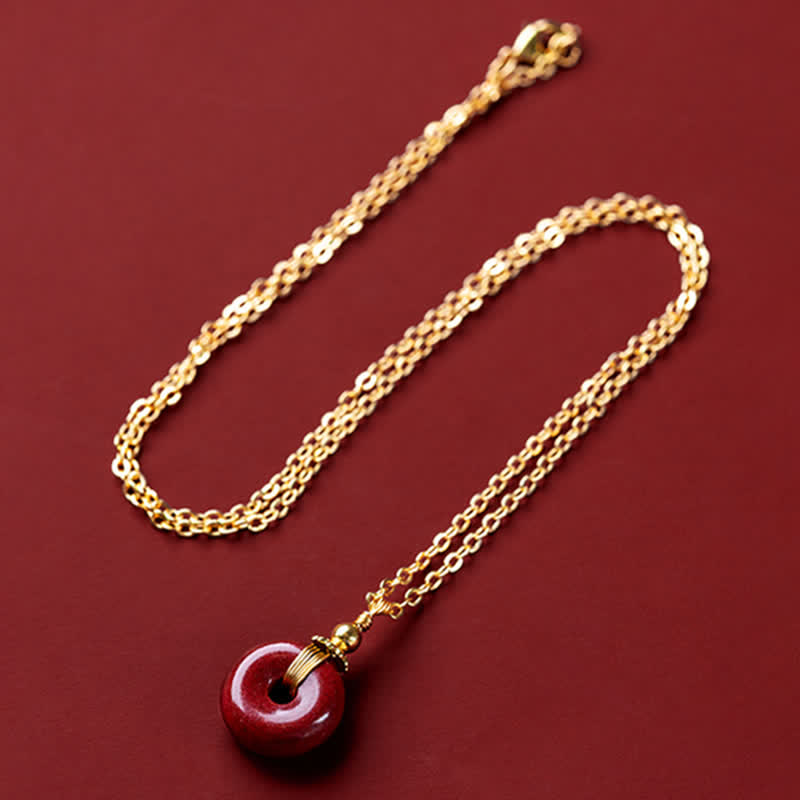 Collier avec pendentif en pierre de cinabre et boucle de paix en Buddha Stones