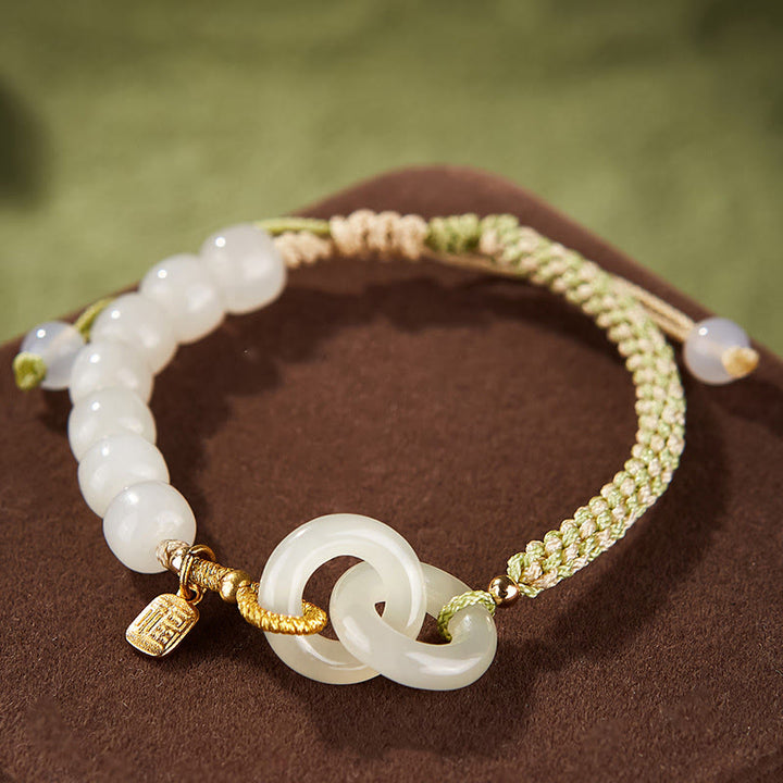 Bracelet tressé en perles de jade Hetian naturelles de Buddha Stones avec boucle de paix double et caractère Fu