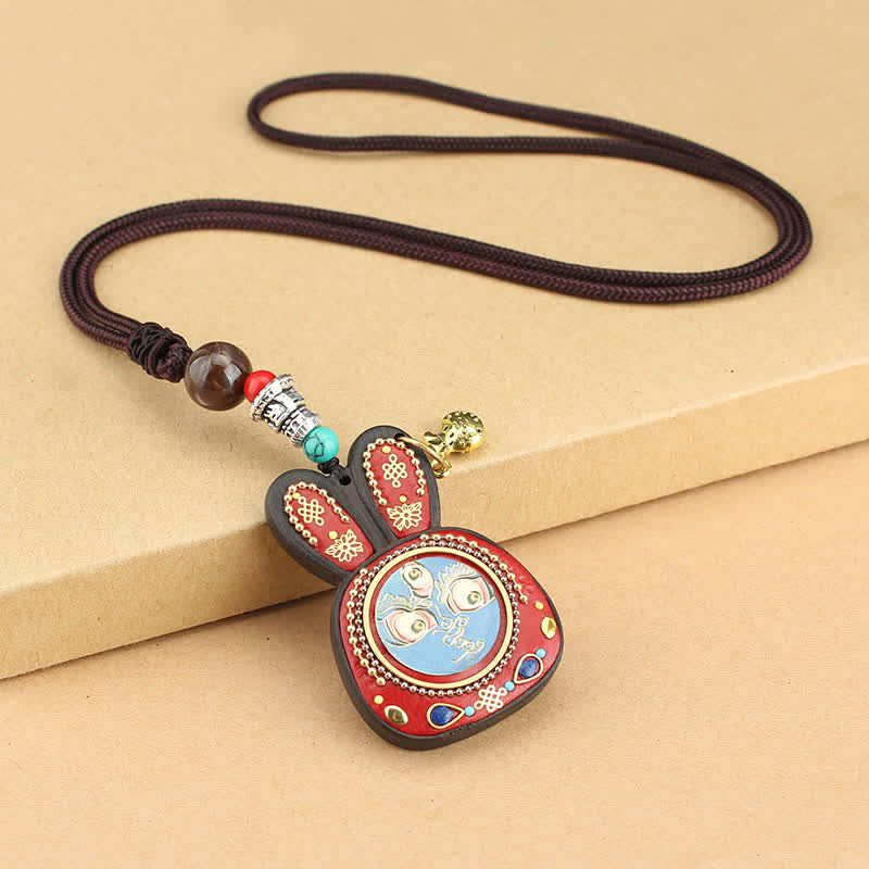 Collier pendentif Thangka en ébène du Tibet représentant les cinq dieux de la richesse