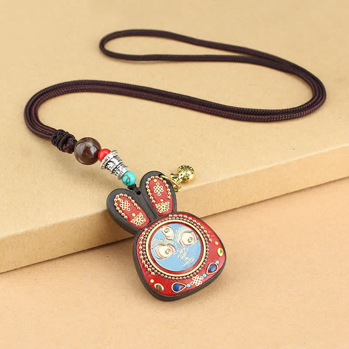 Collier pendentif Thangka en ébène du Tibet représentant les cinq dieux de la richesse