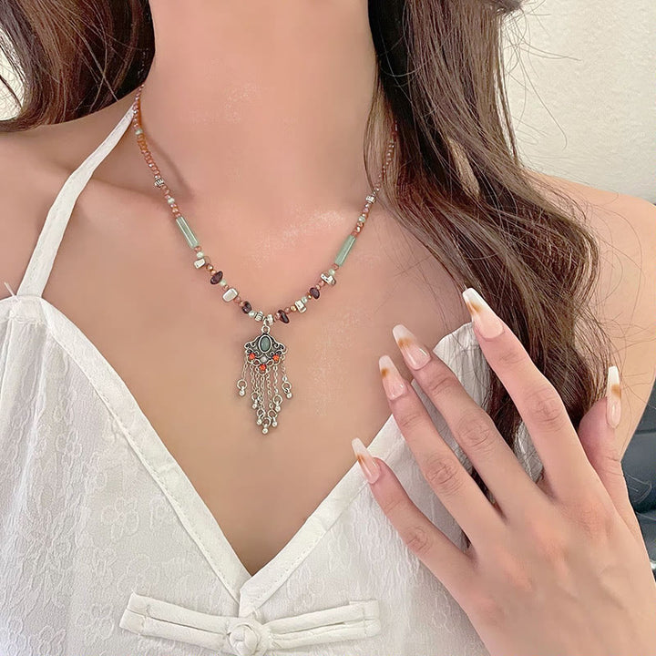 Collier pendentif pompon porte-bonheur en cuivre avec pierres de cristal tibétaines de Buddha Stones