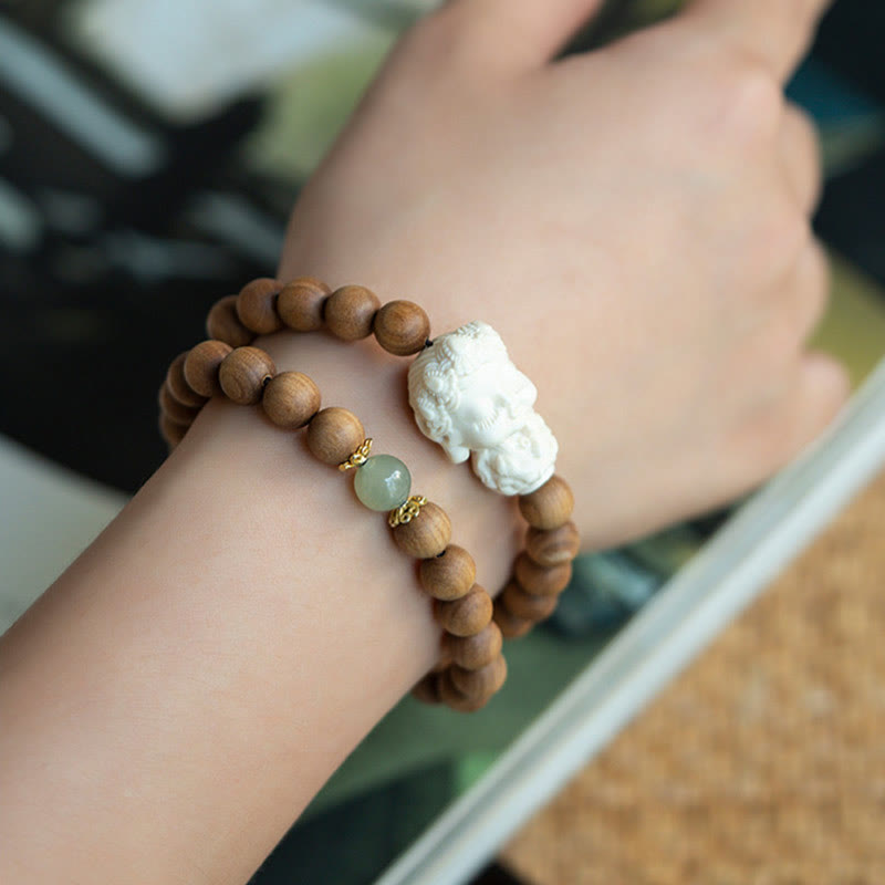 Bracelet de protection Tara verte en Buddha Stones en bois de santal et jade Hetian