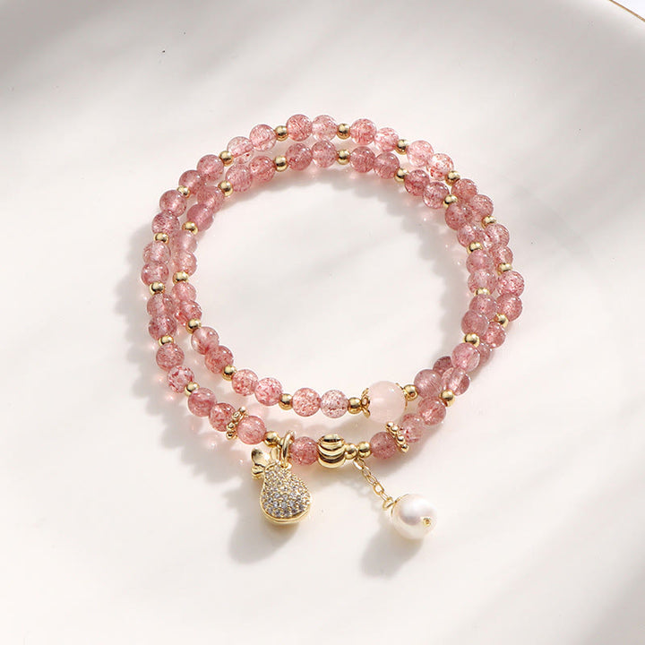 Bracelet double tour avec breloque positive et Buddha Stones en quartz fraise