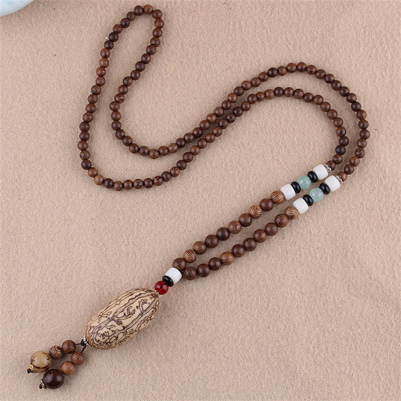 Collier pendentif protection éléphant en Buddha Stones tibétain en bois de wengé Bodhi Seed Agate