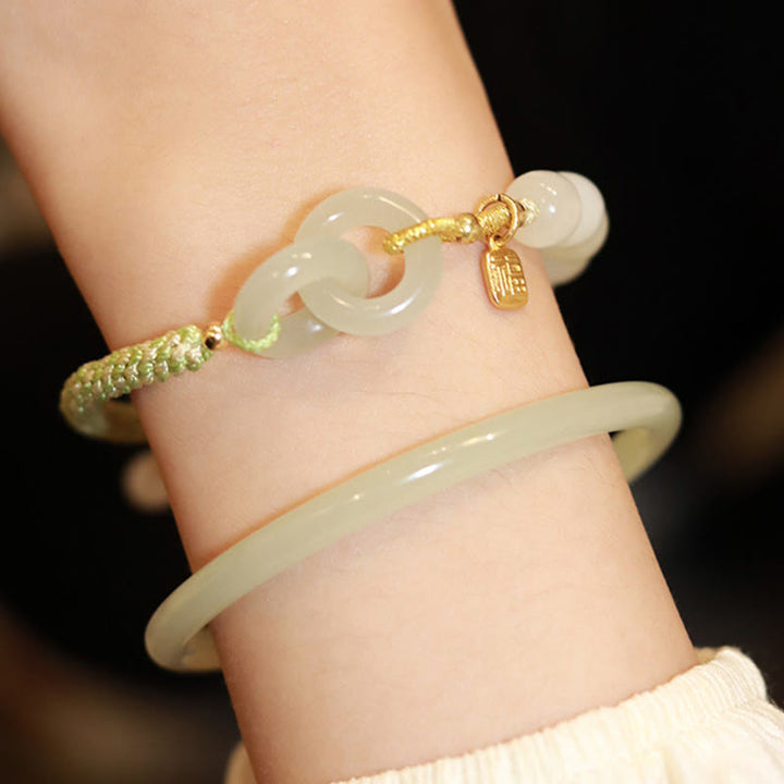 Bracelet tressé en perles de jade Hetian naturelles de Buddha Stones avec boucle de paix double et caractère Fu