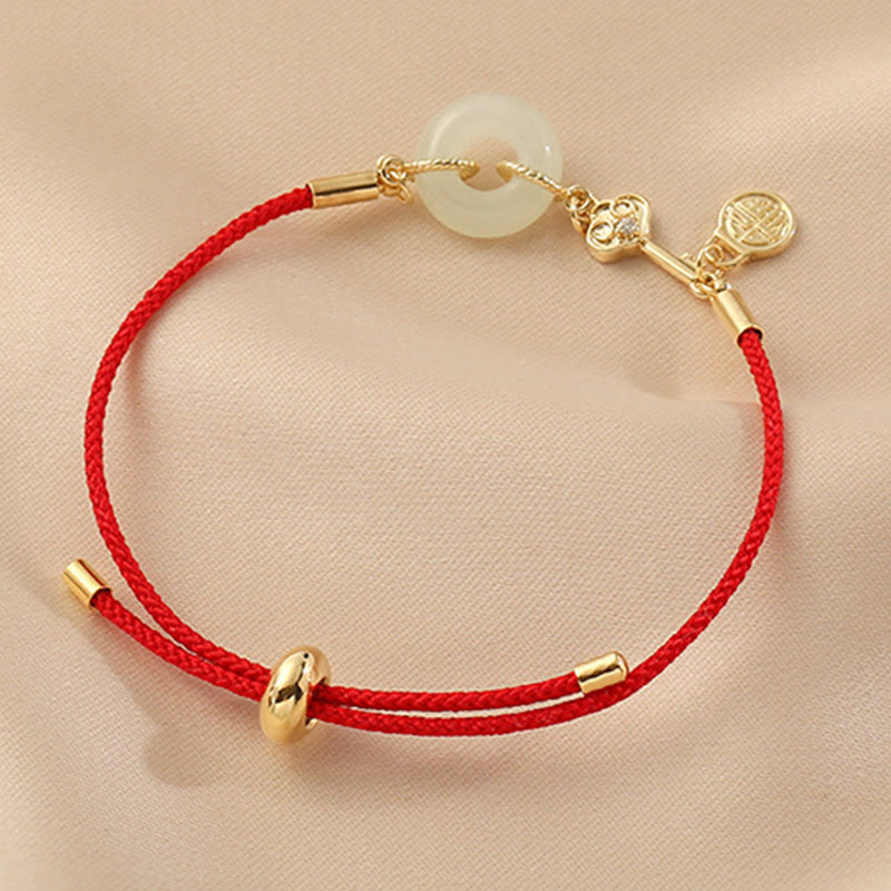 Bracelet en corde rouge avec boucle de paix en jade Hetian plaqué or 18 carats et Buddha Stones
