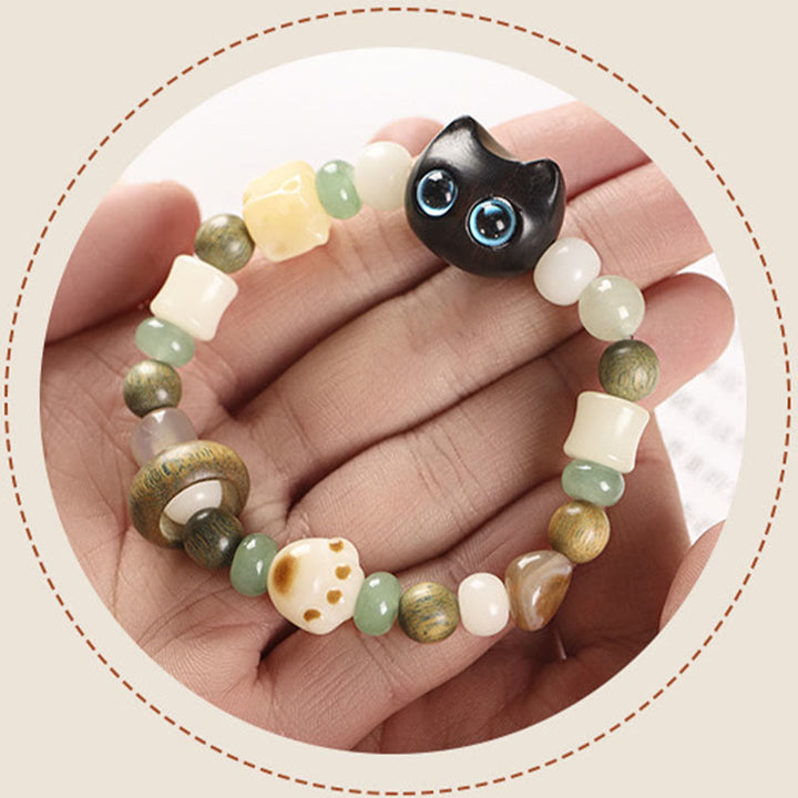Buddha Stones Graine de Bodhi Bois de santal vert Bois d'ébène Petite feuille Bois de santal rouge Tête de chat Patte Griffe Bracelet de paix - image 6