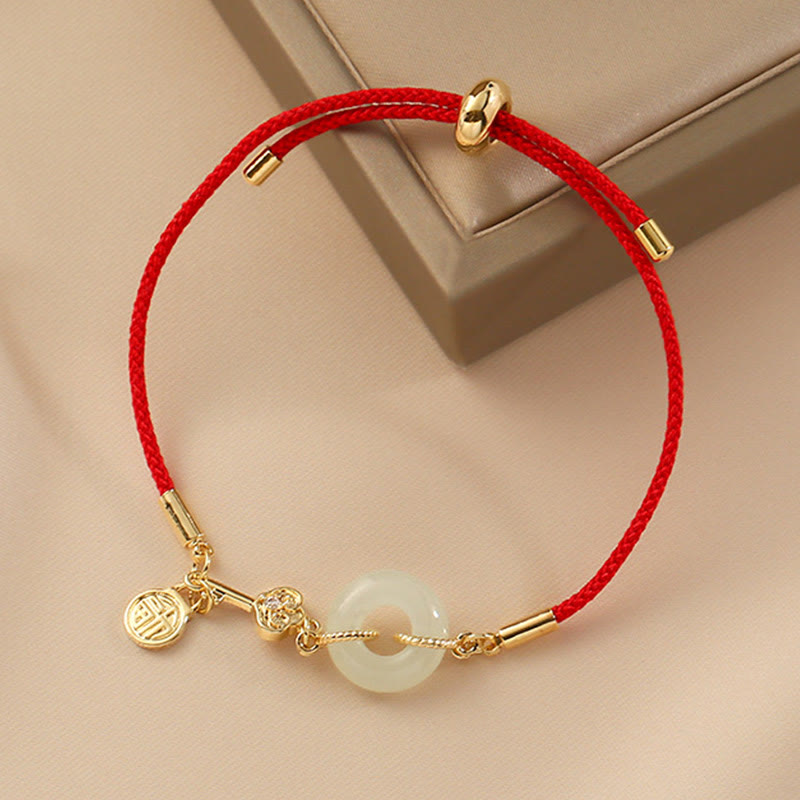 Bracelet en corde rouge avec boucle de paix en jade Hetian plaqué or 18 carats et Buddha Stones