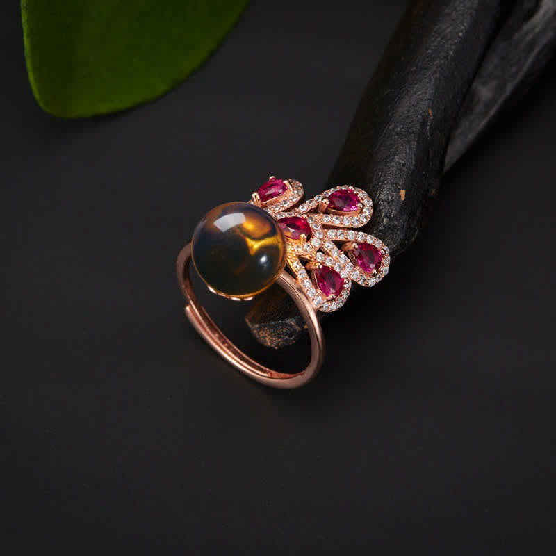 Collier pendentif et bague en ambre avec symbole de la fortune et de l'amour