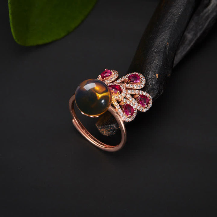 Collier pendentif et bague en ambre avec symbole de la fortune et de l'amour