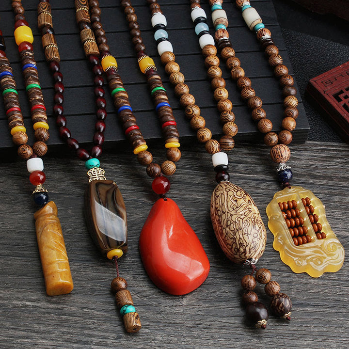 Collier pendentif en Buddha Stones tibétain en bois de wengé Bodhi Seed Agate Balance Peace