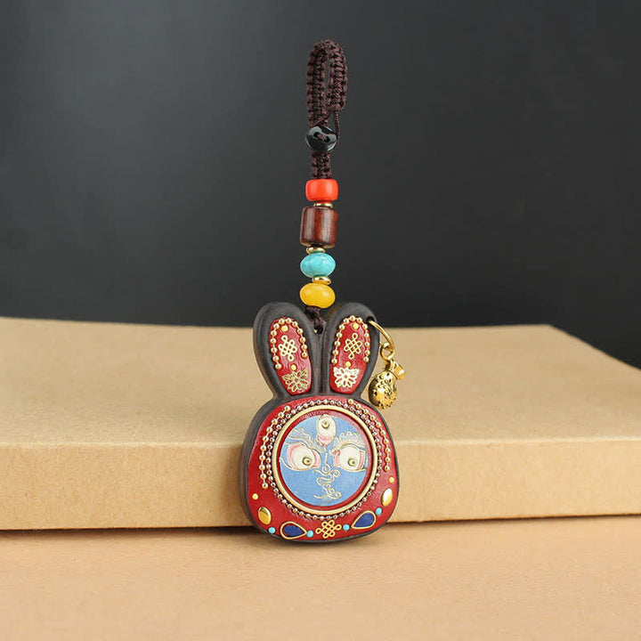 Porte-clés Thangka en ébène du Tibet représentant les cinq dieux de la richesse