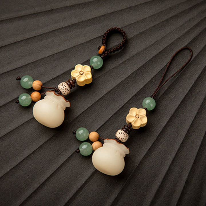 Buddha Stones Sac d'argent de graines de Bodhi naturel Porte-clés de bénédiction de fleur de prospérité