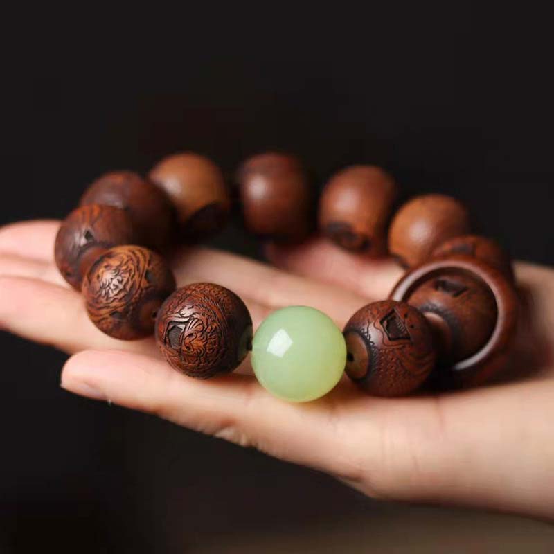 Bracelet de protection du tigre gravé en bois de rose tibétain Buddha Stones