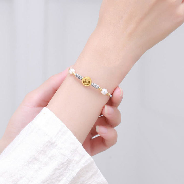 Bracelet tressé en corde bleue avec perles et arbre de fortune en cuivre et Buddha Stones