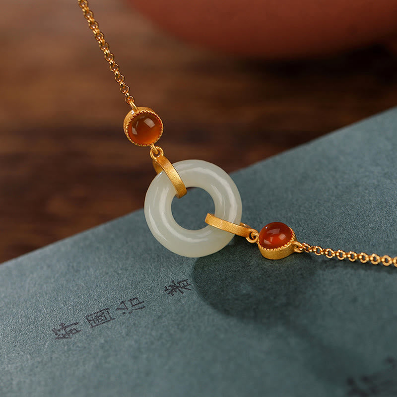 Bracelet porte-bonheur en agate rouge avec boucle de paix en jade naturel Hetian en Buddha Stones - image 1