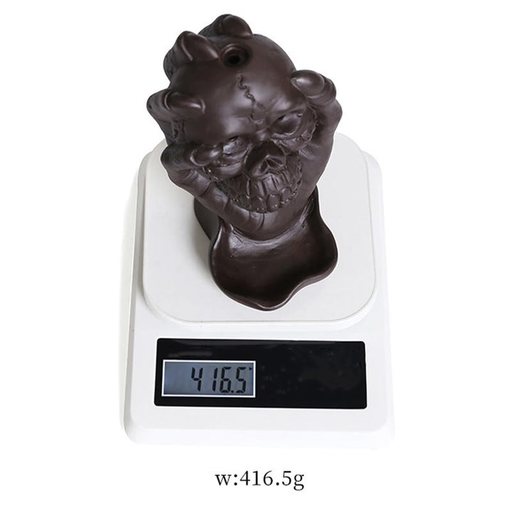 Brûleur d'encens spirituel en argile violette avec tête de mort et main fantôme en Buddha Stones