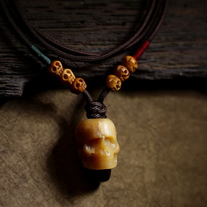 Collier pendentif en os de chameau tibétain Buddha Stones et crâne du Seigneur des cadavres