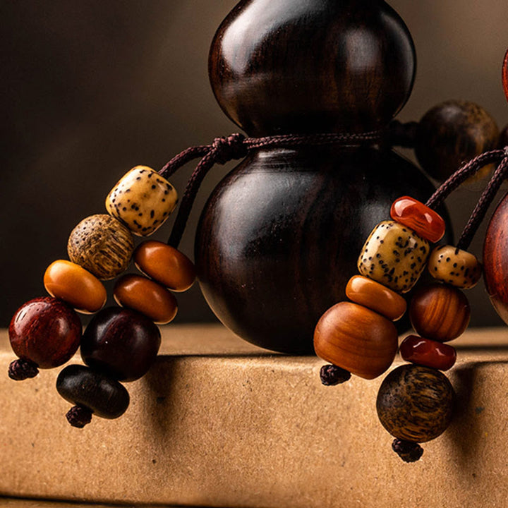 Porte-clés porte-bonheur en ébène tibétain à petites feuilles de gourde en bois de santal rouge