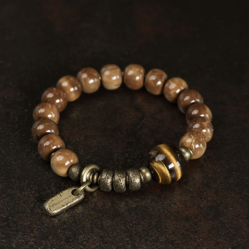 Bracelet porte-bonheur en cuivre et obsidienne dorée avec Buddha Stones de Kuka et œil de tigre