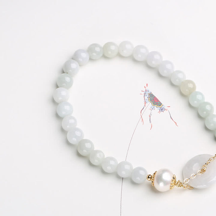 Bracelet de prospérité avec boucle de paix et perles de jade naturelles en Buddha Stones