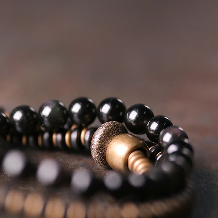 Bracelet triple tour de guérison en cuivre et bois d'ébène avec Buddha Stones arc-en-ciel et obsidienne