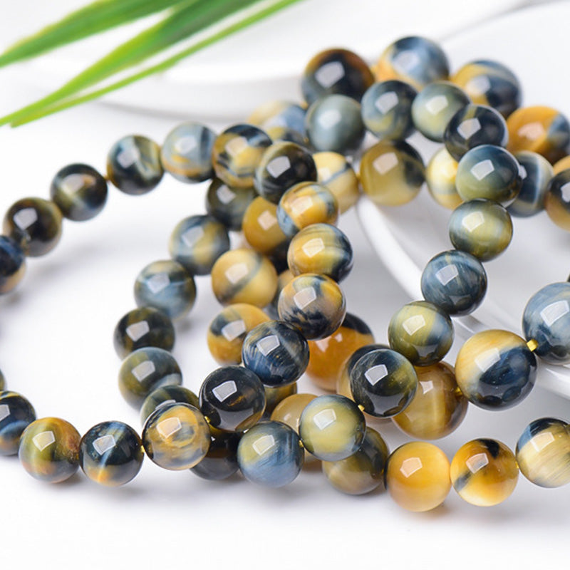 Bracelet de force, de courage et de protection en œil de tigre avec Buddha Stones