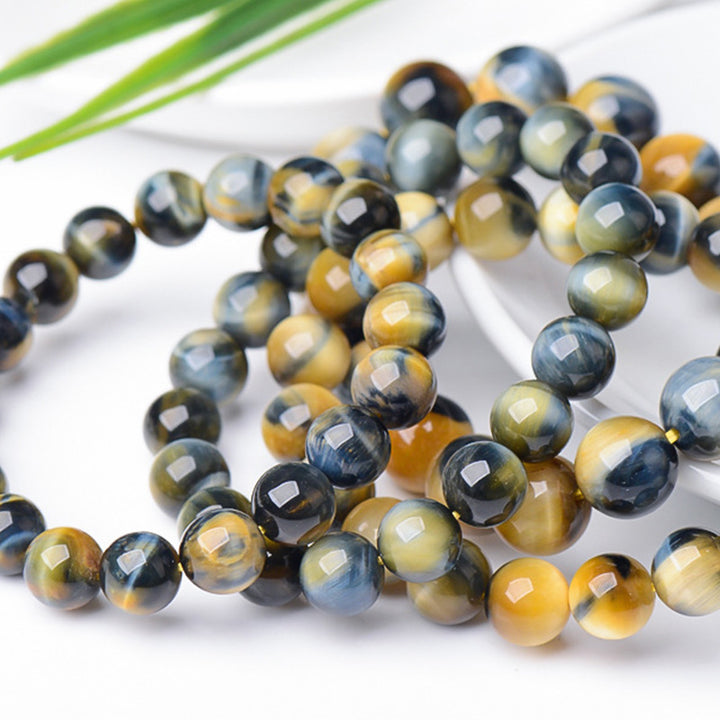 Bracelet de force, de courage et de protection en œil de tigre avec Buddha Stones