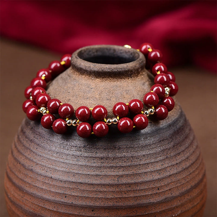 Bracelet de bénédiction en perles de cinabre naturelles de Buddha Stones