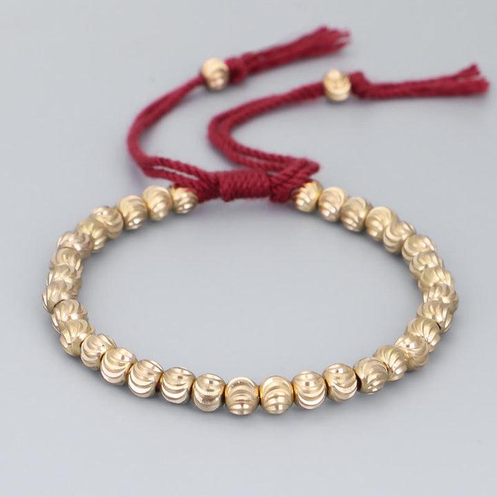 Bracelet porte-bonheur en perles de cuivre tibétaines faites à la main avec Buddha Stones
