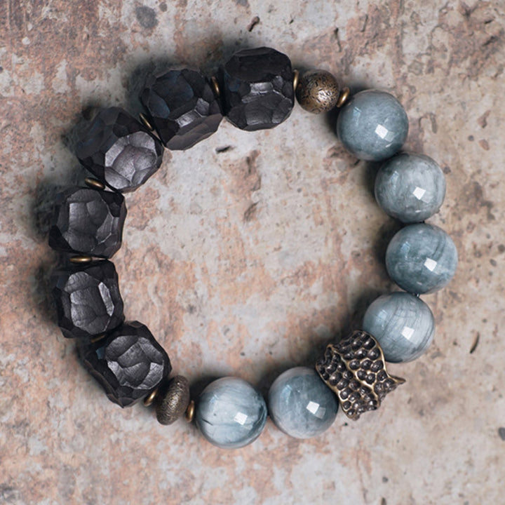 Bracelet de couple en cuivre et bois d'ébène avec pierre œil d'aigle et Buddha Stones