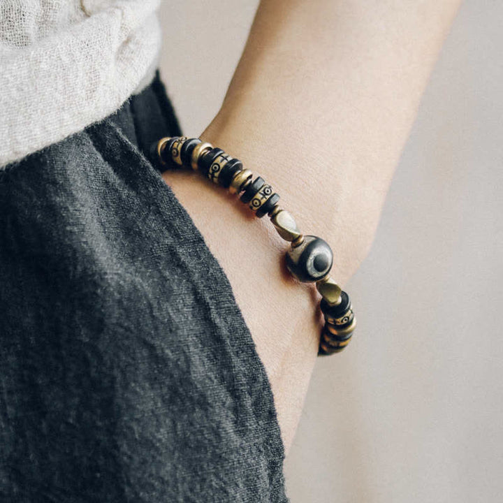 Bracelet de force en bois d'ébène et perles d'os tibétaines en Buddha Stones