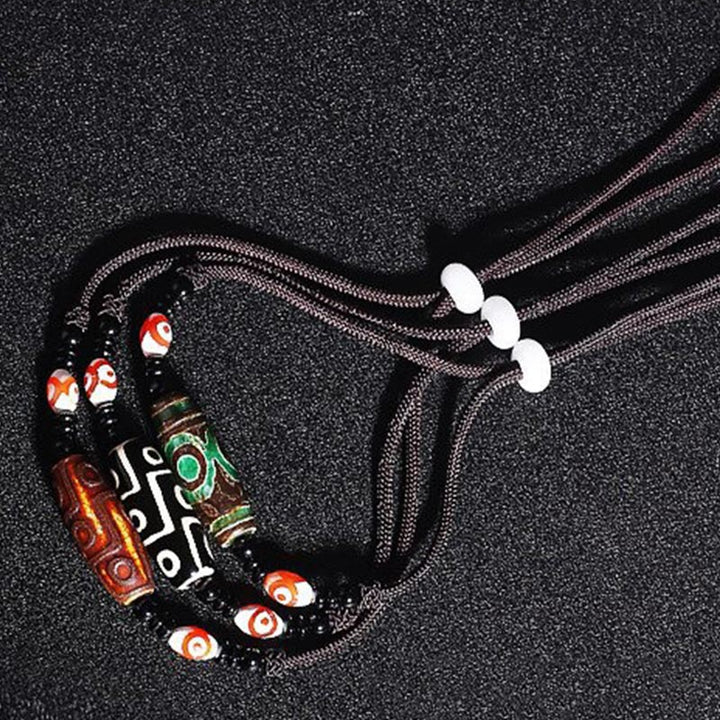 Collier de protection en perles tibétaines à neuf yeux Dzi Buddha Stones
