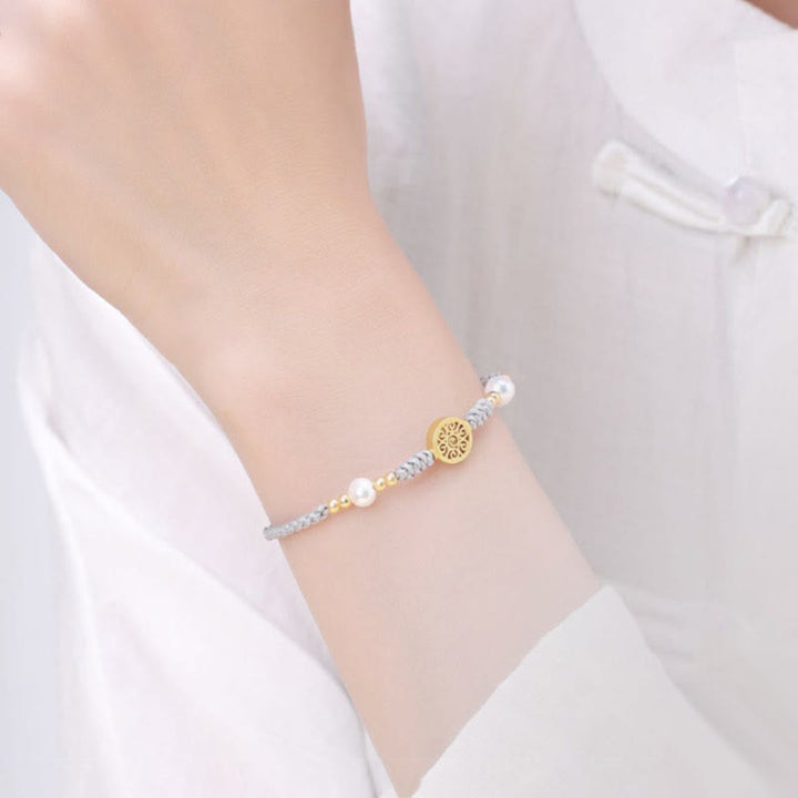 Bracelet tressé en corde bleue avec perles et arbre de fortune en cuivre et Buddha Stones