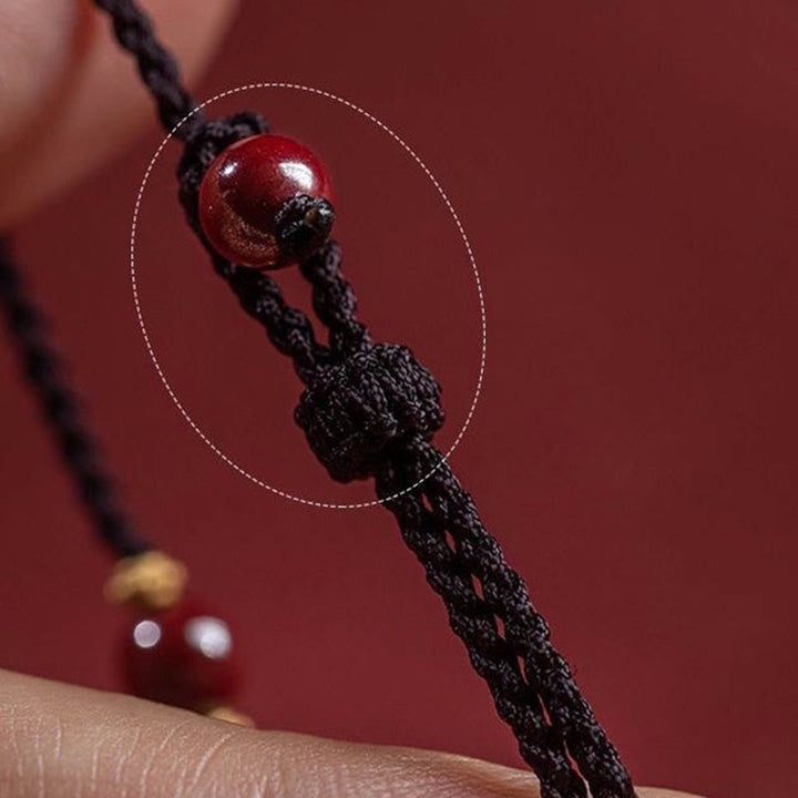 Bracelet tressé avec breloque et bénédiction en perles de cinabre et Buddha Stones