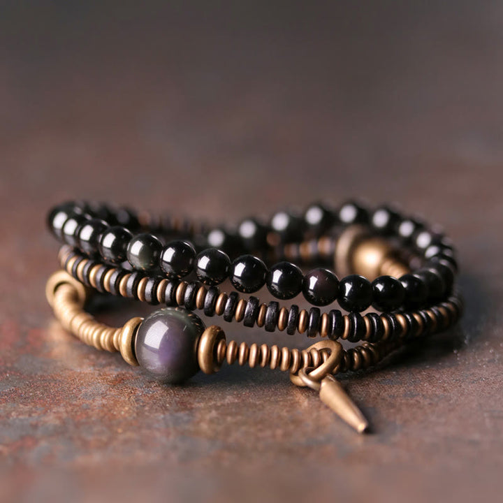 Bracelet triple tour de guérison en cuivre et bois d'ébène avec Buddha Stones arc-en-ciel et obsidienne