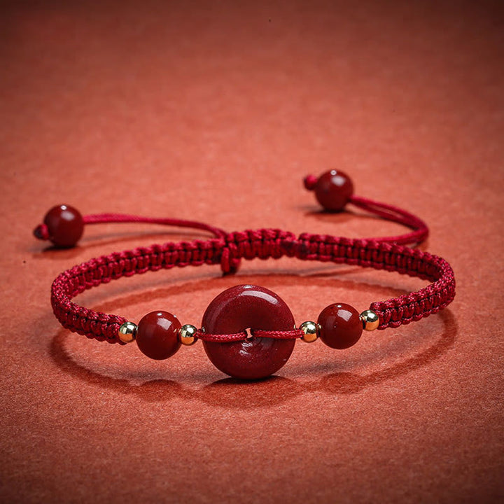 Bracelet de bénédiction en corde avec boucle de paix en cinabre naturel et Buddha Stones