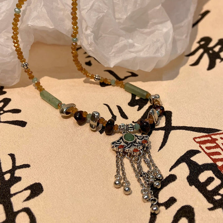 Collier pendentif pompon porte-bonheur en cuivre avec pierres de cristal tibétaines de Buddha Stones