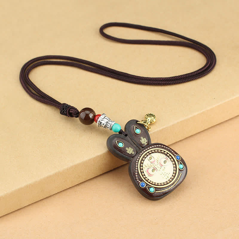Collier pendentif Thangka en ébène du Tibet représentant les cinq dieux de la richesse