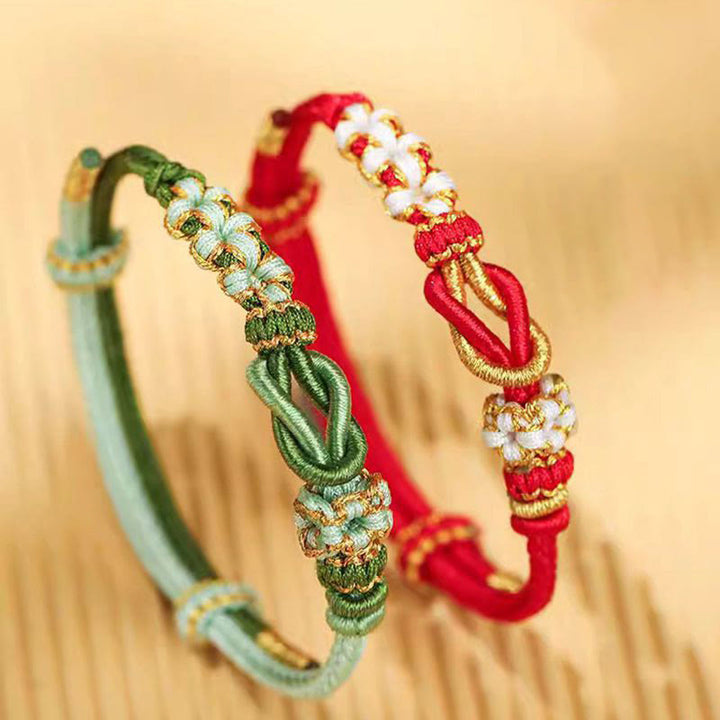 Bracelet de protection porte-bonheur fait main en Buddha Stones avec nœud en fleur de pêcher à huit fils