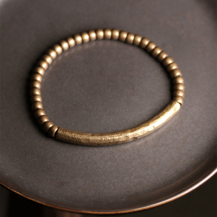 Bracelet porte-bonheur en perles de cuivre et de laiton au design simple Buddha Stones